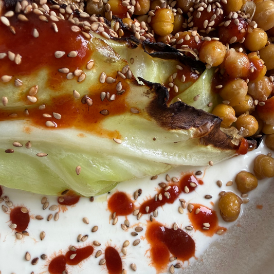 Charred Hispi Cabbage with Garlic Yogurt, Harissa & Crispy Chickpeas
