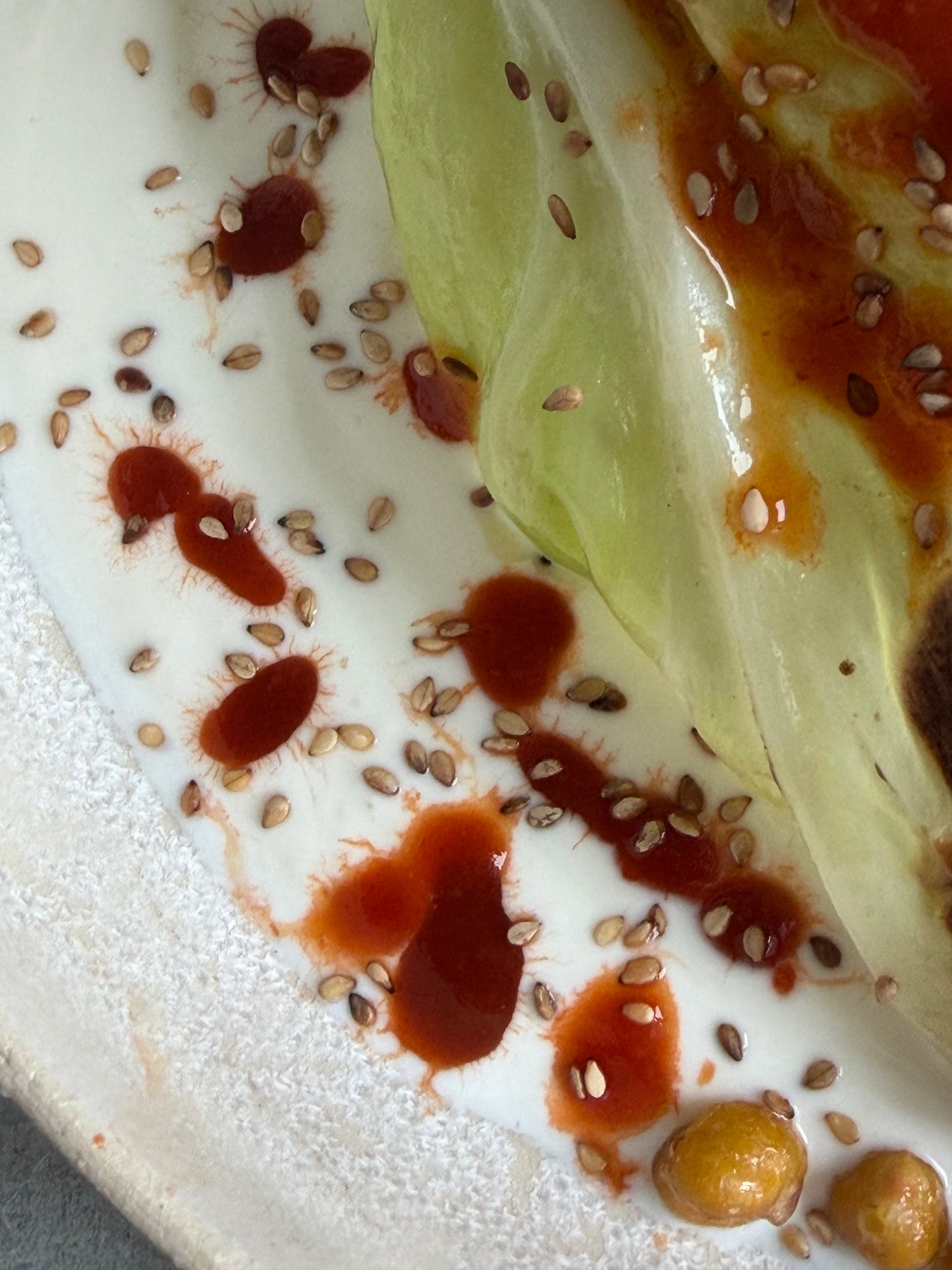 Charred Hispi Cabbage with Garlic Yogurt, Harissa & Crispy Chickpeas