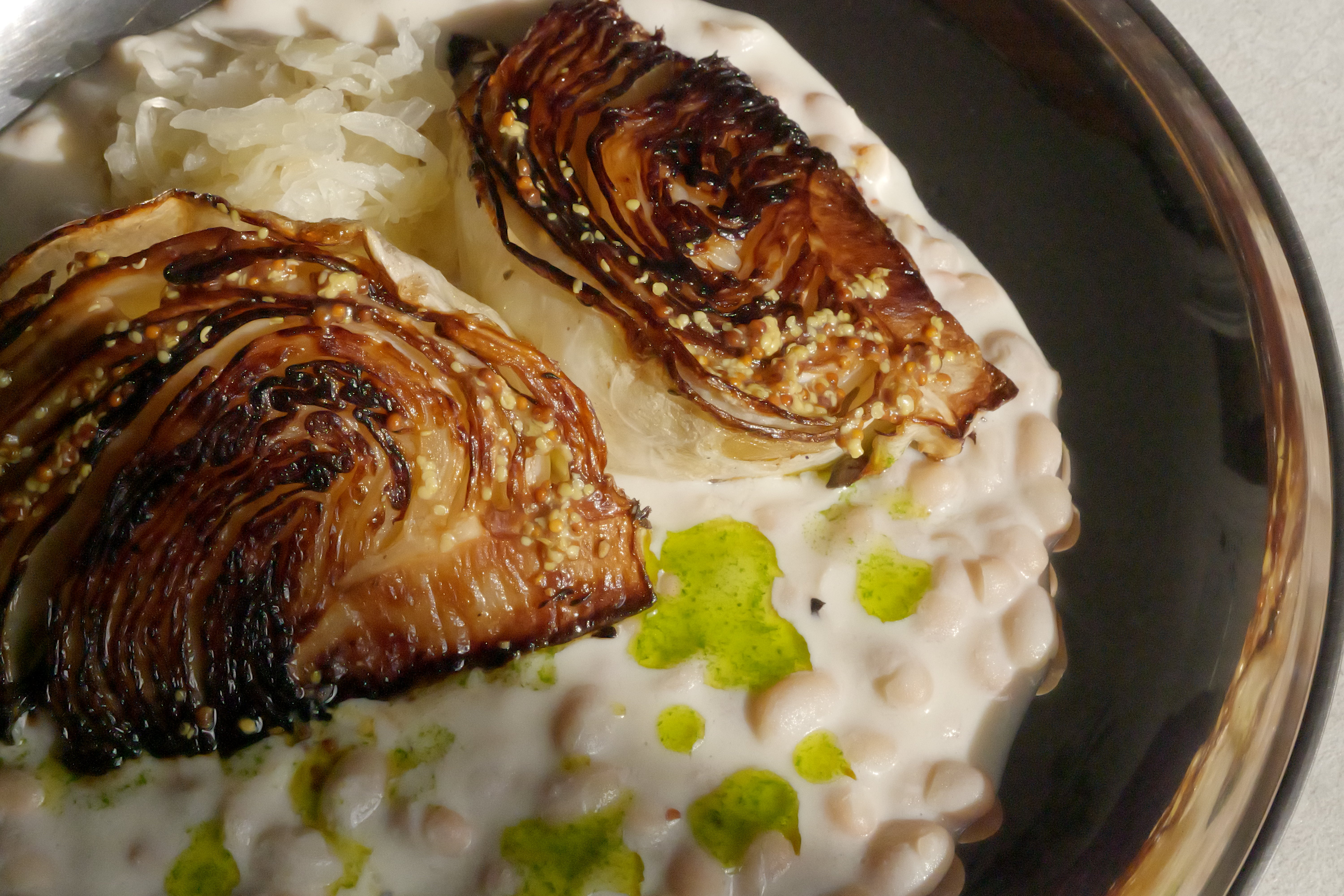 Image of Roasted Cabbage with Tofu–Olive Oil Cream, White Beans, Sauerkraut, Parsley Oil & Dijon Mustard