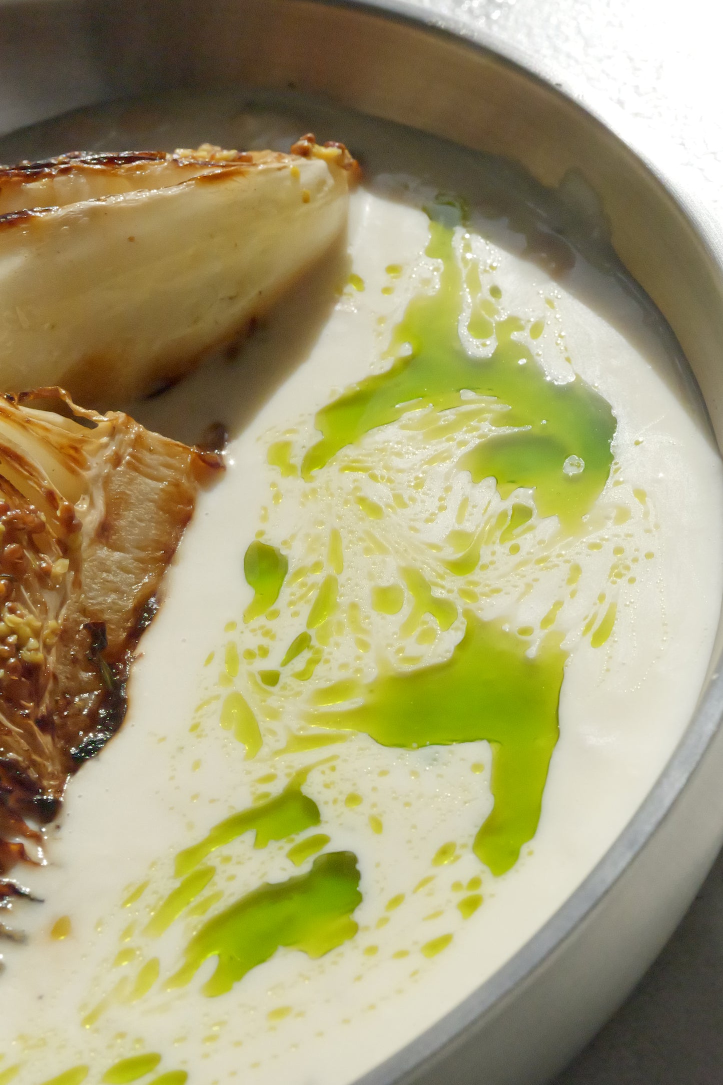Charred Cabbage with Tofu–Olive Oil Cream, White Beans, Sauerkraut, Parsley Oil & Dijon Mustard