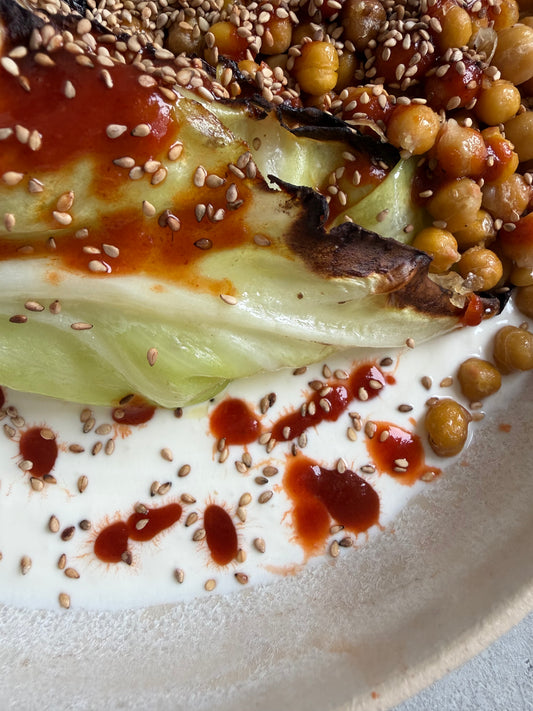 Charred Hispi Cabbage with Garlic Yogurt, Harissa & Crispy Chickpeas
