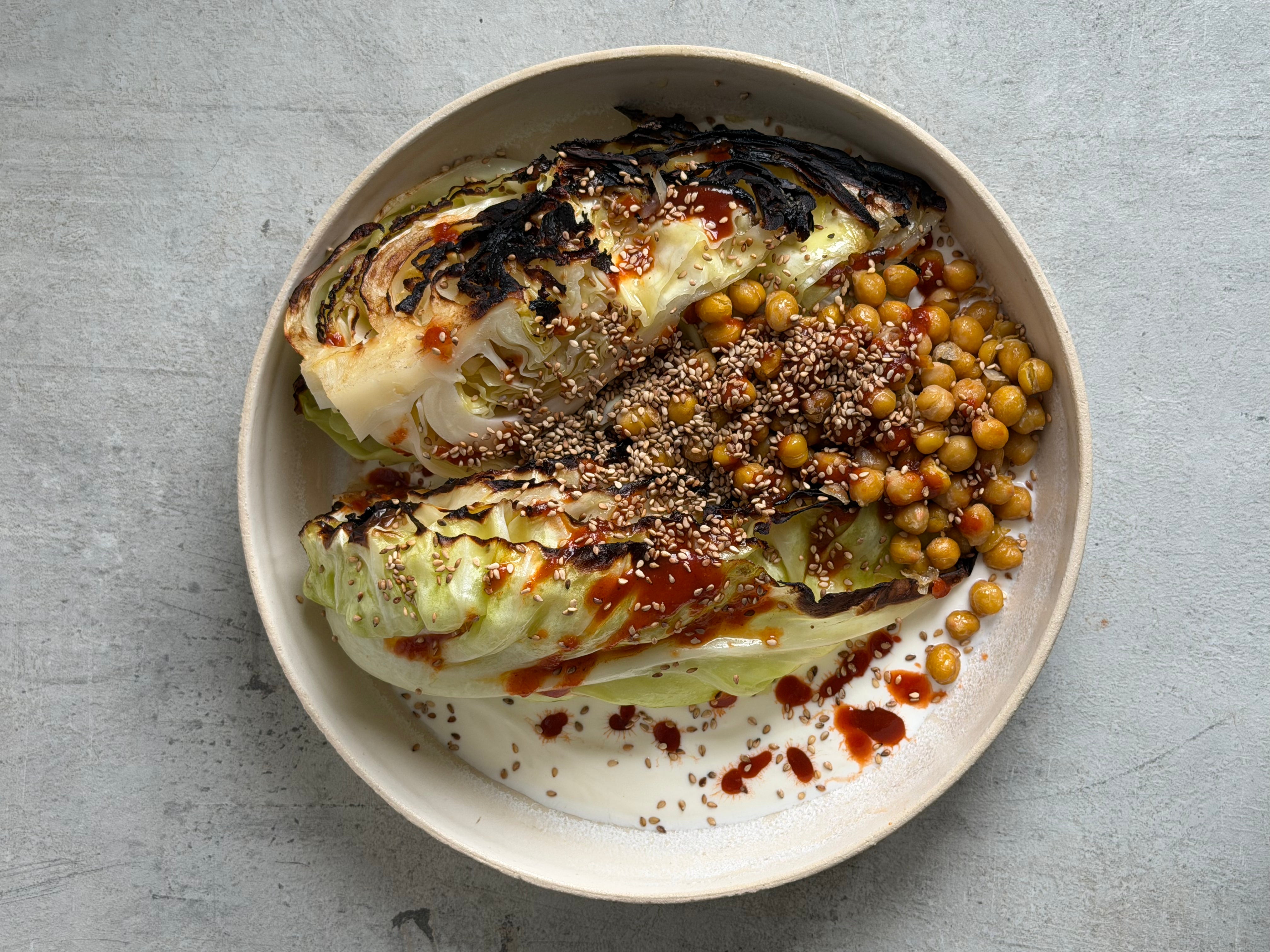 Image of Charred Hispi Cabbage with Garlic Yogurt, Harissa & Crispy Chickpeas