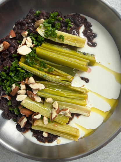 Velvety Cacao & Cumin Black Beans with Sweet Tajine-Style Plums, Charred Leek & Whipped Goat Cheese