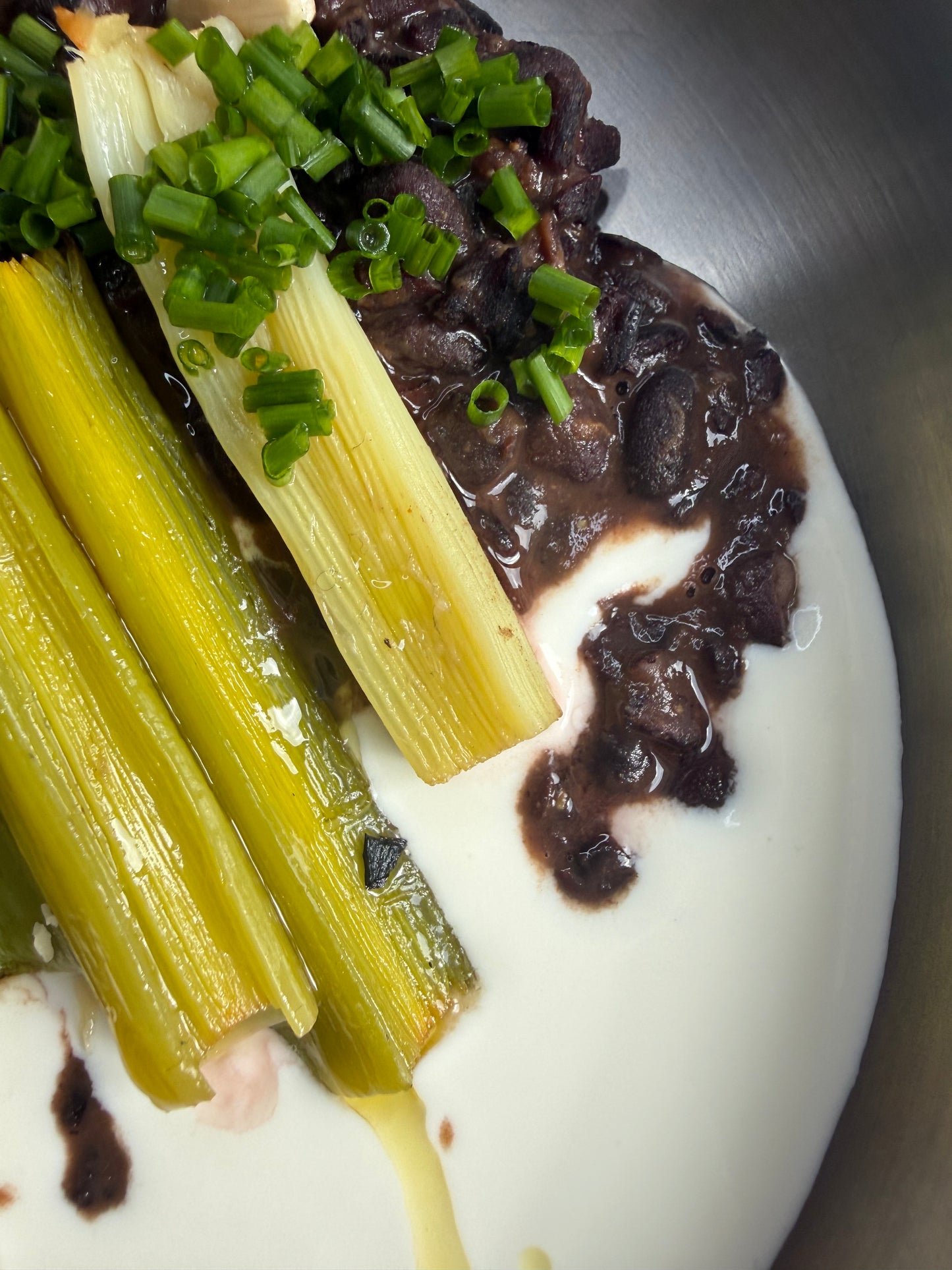 Velvety Cacao & Cumin Black Beans with Sweet Tajine-Style Plums, Charred Leek & Whipped Goat Cheese