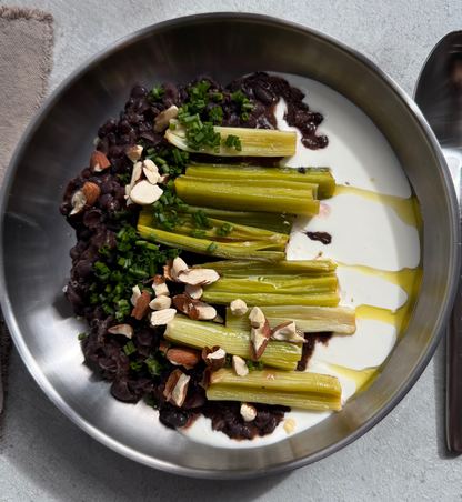 Velvety Cacao & Cumin Black Beans with Sweet Tajine-Style Plums, Charred Leek & Whipped Goat Cheese