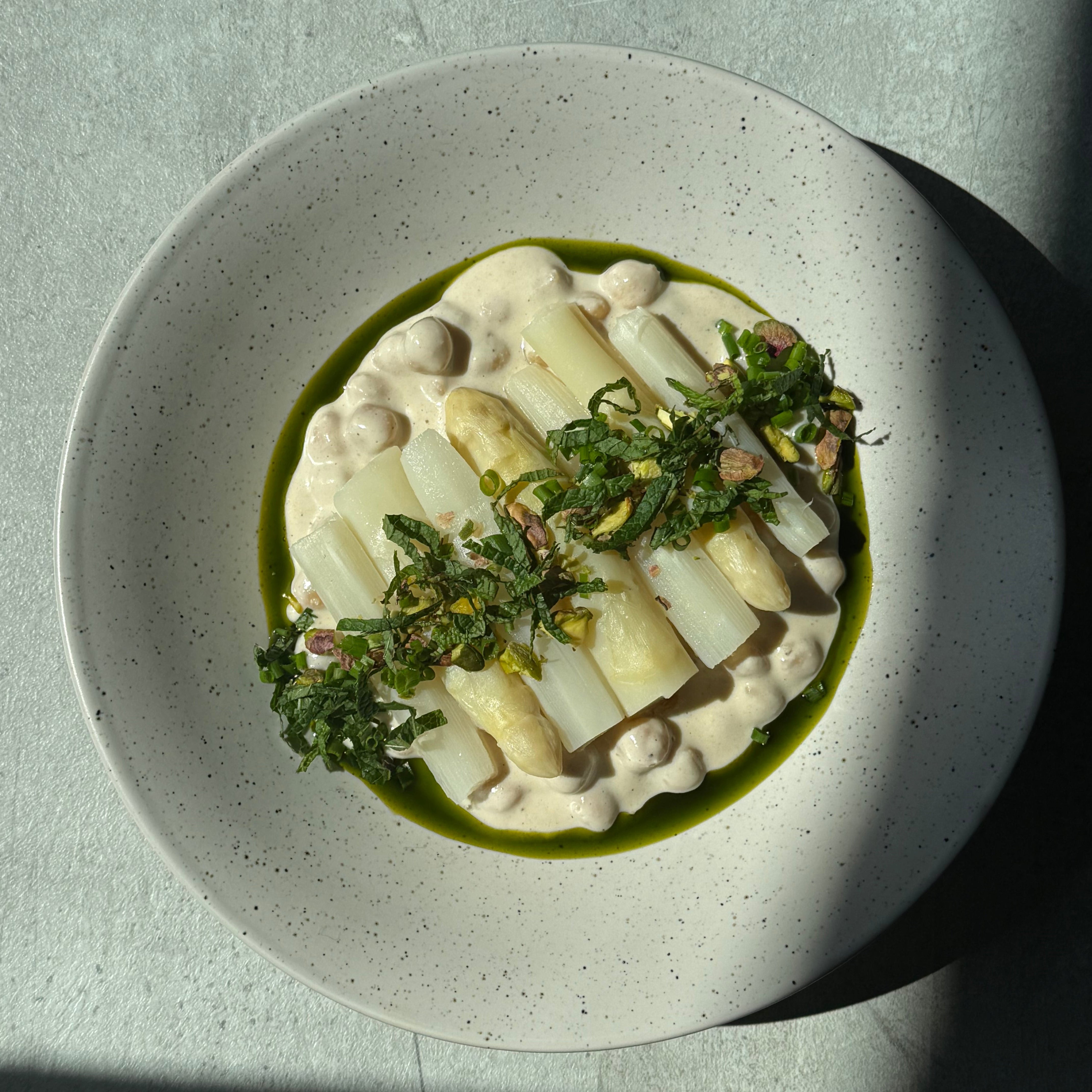 Image of White Asparagus & Chickpeas Umami Glow with Sichuan Potato Salad, Fresh Herbs & Pistachios