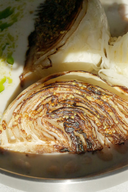 Charred Cabbage with Tofu–Olive Oil Cream, White Beans, Sauerkraut, Parsley Oil & Dijon Mustard