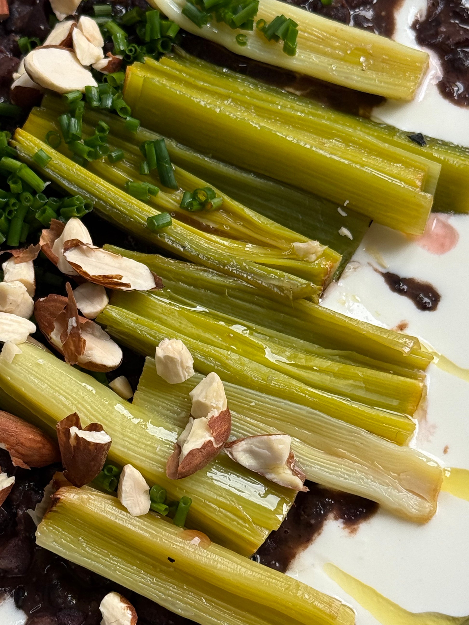 Velvety Cacao & Cumin Black Beans with Sweet Tajine-Style Plums, Charred Leek & Whipped Goat Cheese