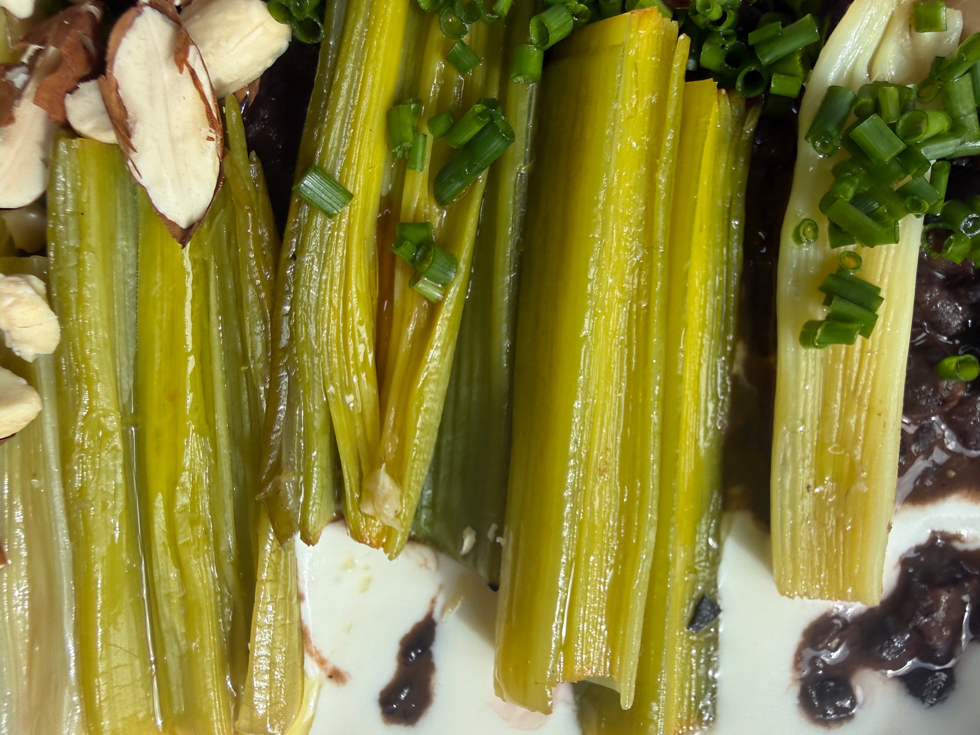 Velvety Cacao & Cumin Black Beans with Sweet Tajine-Style Plums, Charred Leek & Whipped Goat Cheese