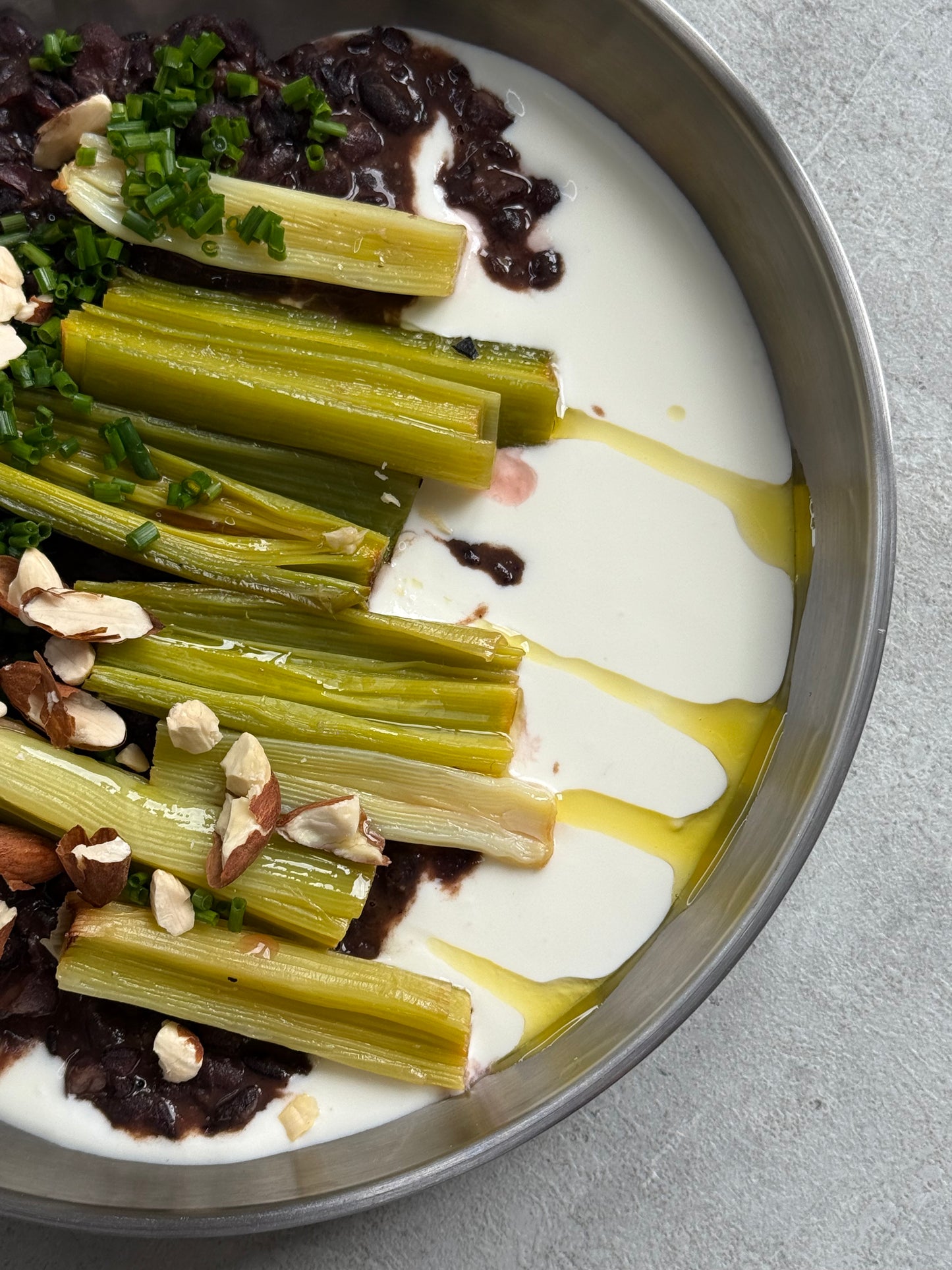 Velvety Cacao & Cumin Black Beans with Sweet Tajine-Style Plums, Charred Leek & Whipped Goat Cheese