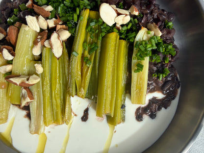 Velvety Cacao & Cumin Black Beans with Sweet Tajine-Style Plums, Charred Leek & Whipped Goat Cheese