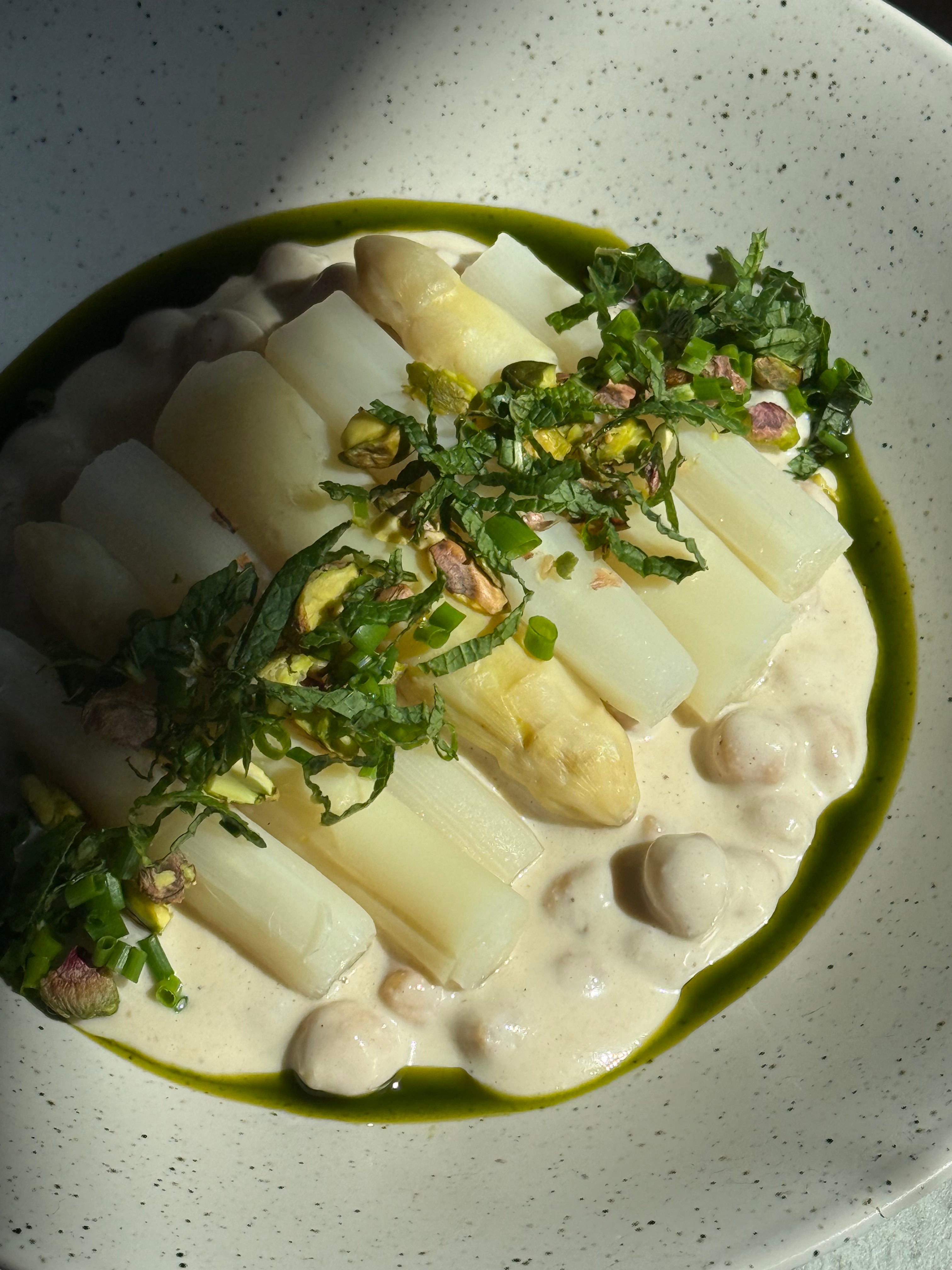 Image of White Asparagus & Chickpeas Umami Glow with Sichuan Potato Salad, Fresh Herbs & Pistachios